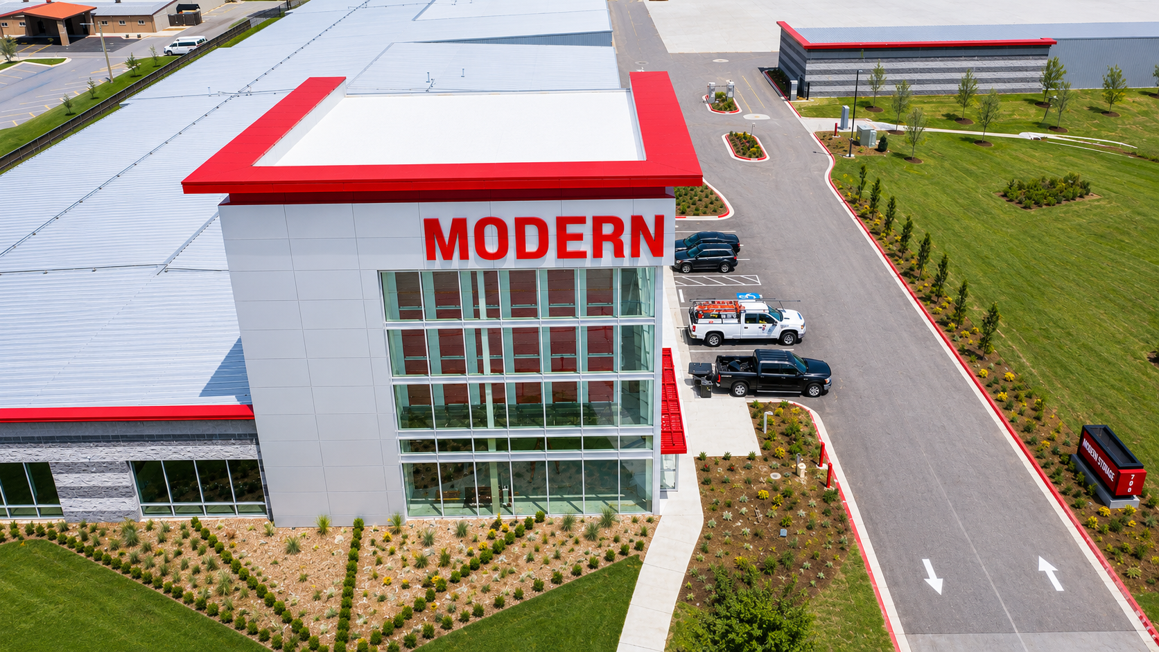 Modern Storage® Bentonville Facility Exterior Modern Storage® Bentonville facility exterior on SW 14th Street with multi-story climate-controlled storage building and parking area